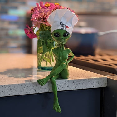 Alien Invasion “Kiss the Cook” Female Alien Statue with Chef’s Hat 10 “ H Alien Shelf Sitter Funny Kitchen or Home Decoration